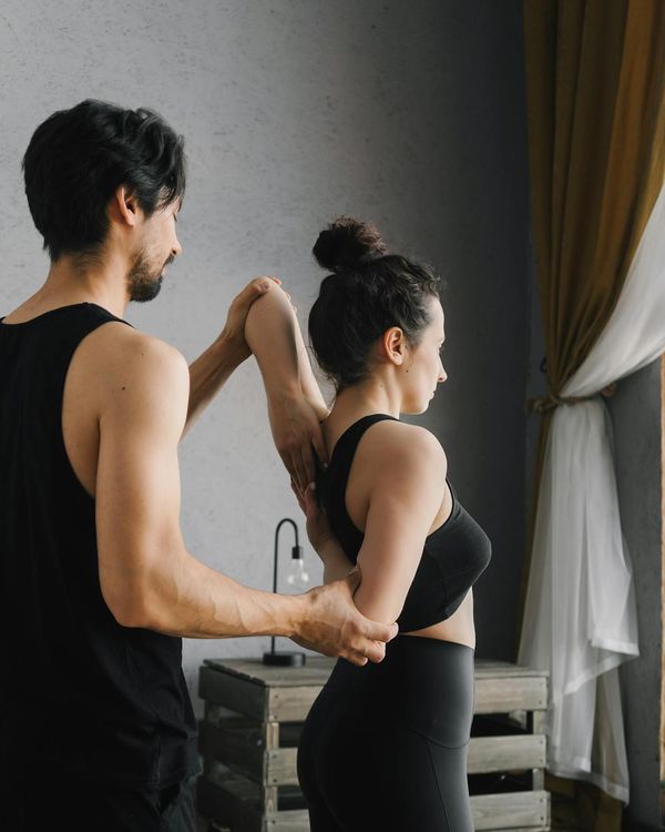 Person feeling vital and energetic after a yoga session, looking towards the light.